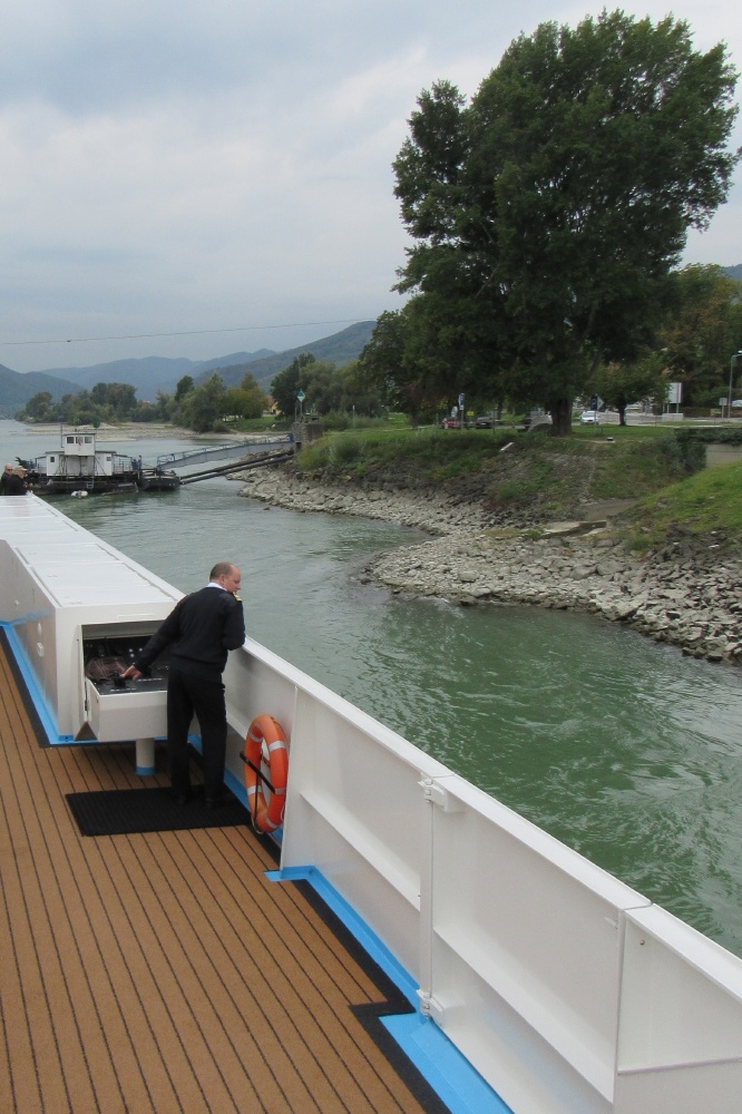 Captain at the docking helm